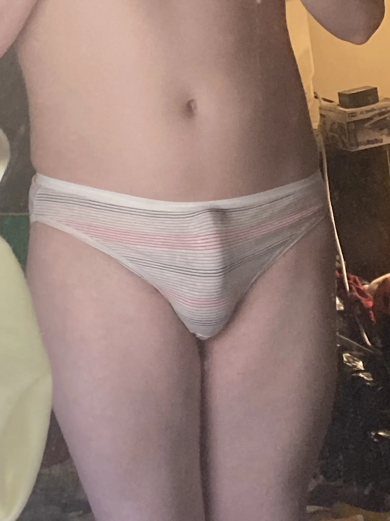 my lower torso with like a slight boner in brand new panties